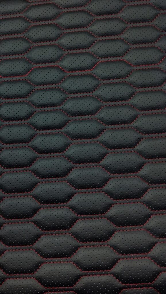 Перфорированная экокожа с красной прострочкой — Автостудия K9